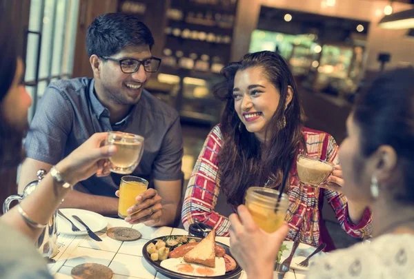 Friends sharing a meal at a restaurant