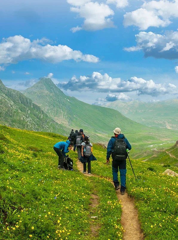 Members trekking together in the mountains